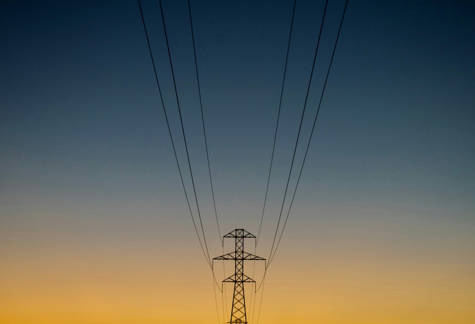 gray utility post during golden hour