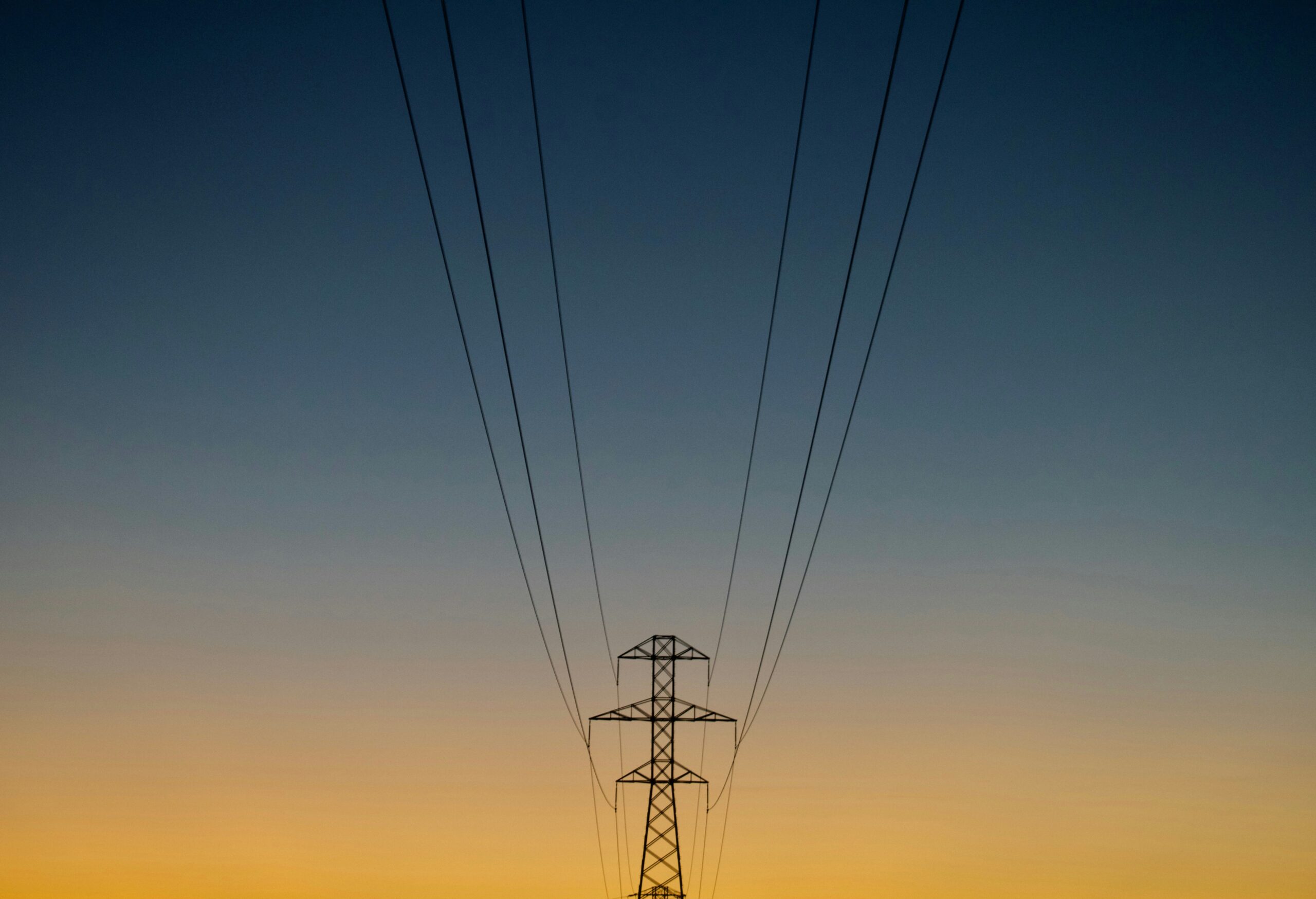 gray utility post during golden hour