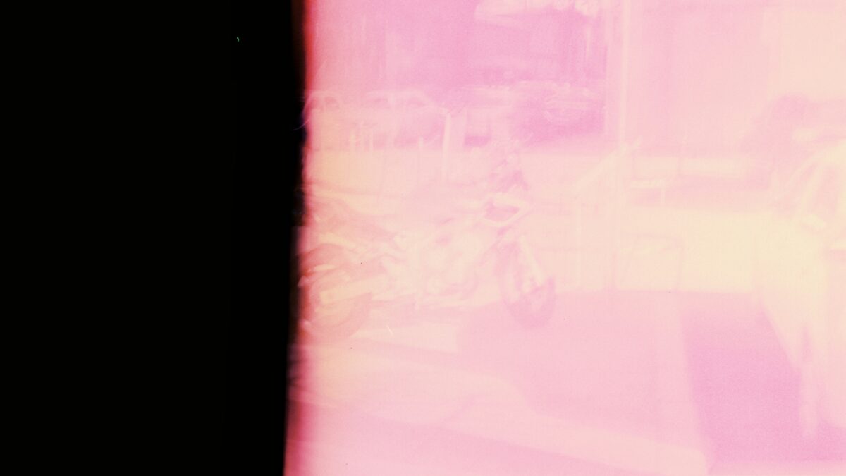 a blurry photo of a person walking down a street